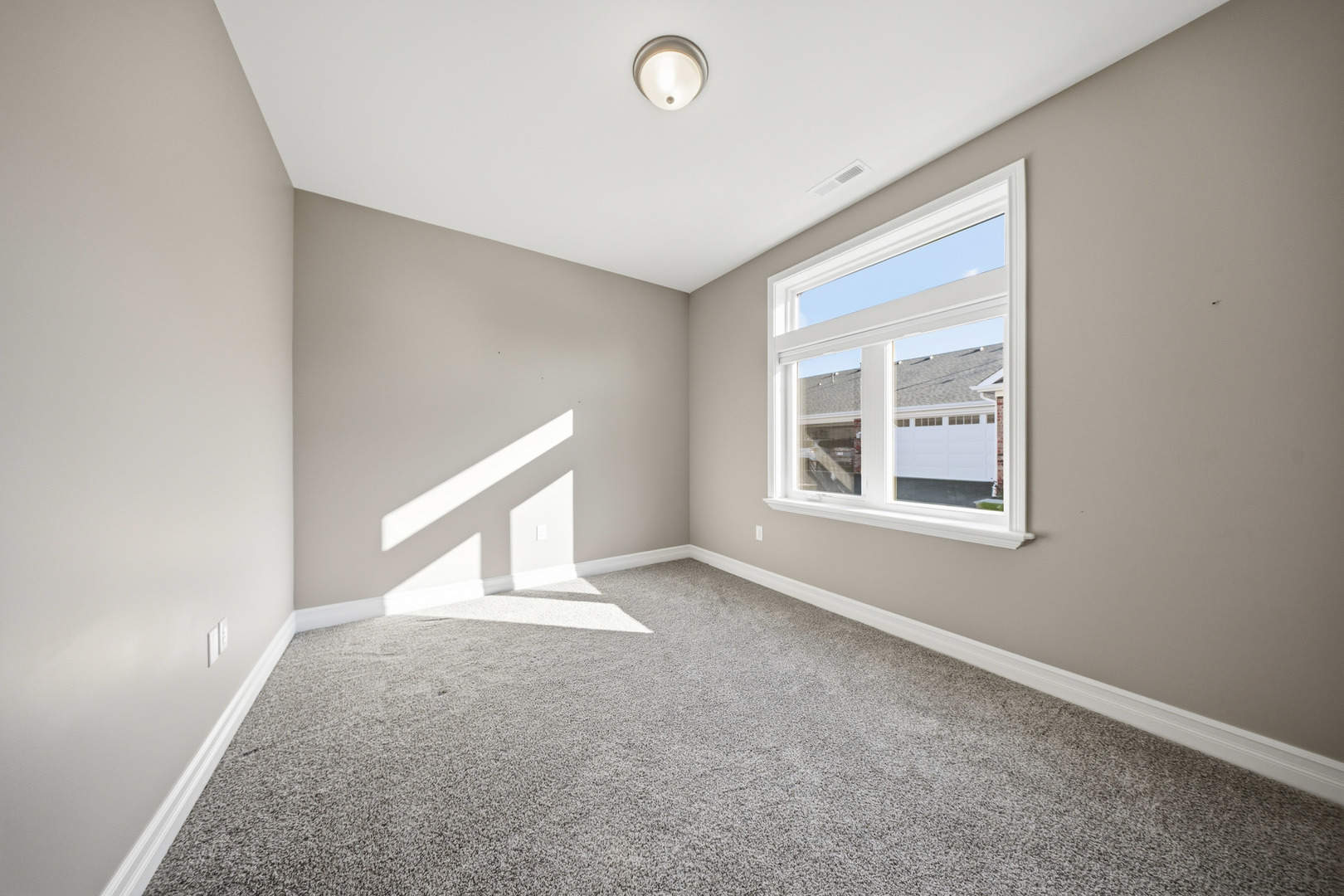 437 Stearn Drive, Unit 437 Genoa, IL 60135 - Photo 6 of 50 an empty room with windows