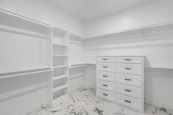 a view of an empty walk in closet