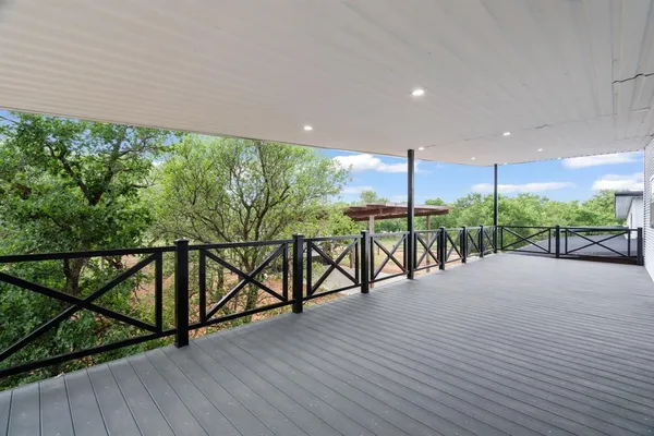 a view of a patio with wooden floor