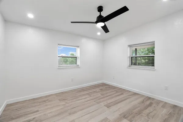 a view of an empty room with a window