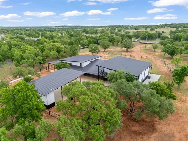 an aerial view of a house with a garden