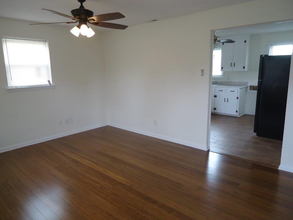 800 St James Church Road Newton, NC 28658 - Photo 2 of 27 a view of empty room with wooden floor and fan