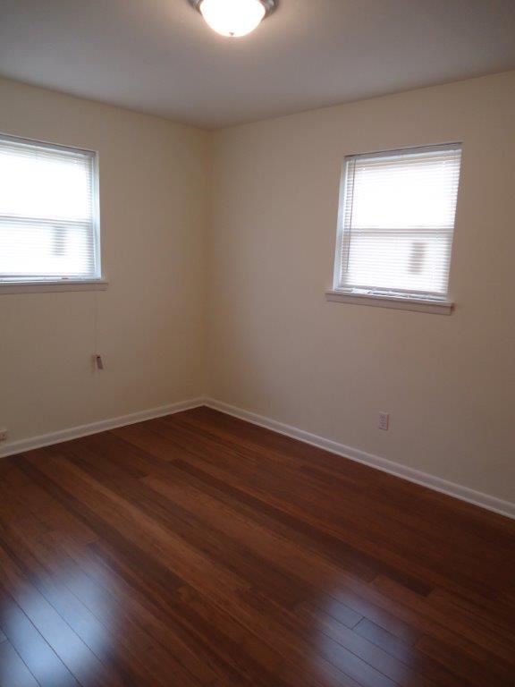 800 St James Church Road Newton, NC 28658 - Photo 11 of 27 a view of a room with wooden floors and window
