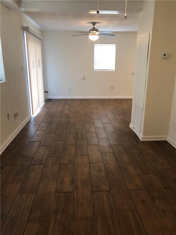 800 St James Church Road Newton, NC 28658 - Photo 14 of 27 en empty room with wooden floor and window