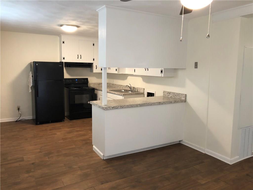 800 St James Church Road Newton, NC 28658 - Photo 15 of 27 a utility room with cabinets washer and dryer