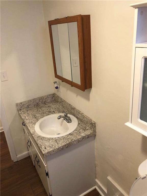 800 St James Church Road Newton, NC 28658 - Photo 20 of 27 a bathroom with a granite countertop sink and a mirror