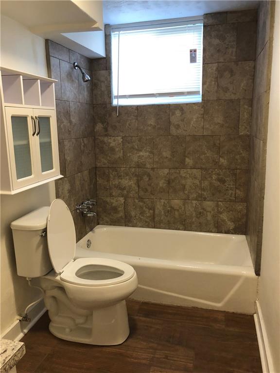 800 St James Church Road Newton, NC 28658 - Photo 21 of 27 a bathroom with a toilet and a bath tub