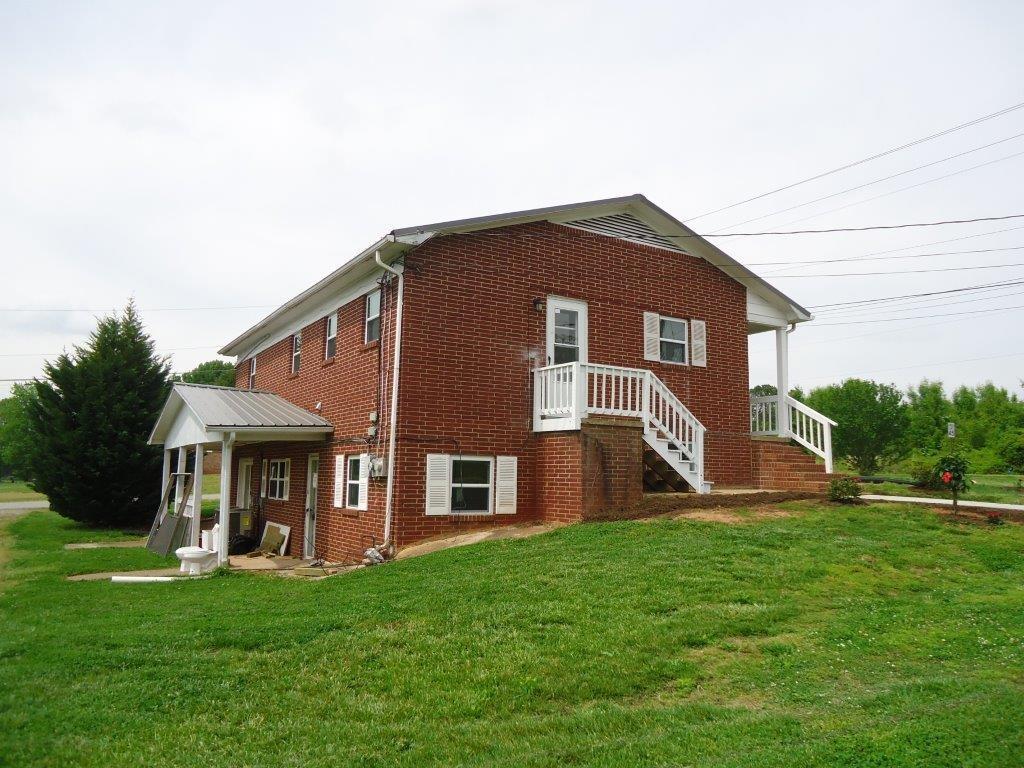 800 St James Church Road Newton, NC 28658 - Photo 22 of 27 a front view of house with yard and green space