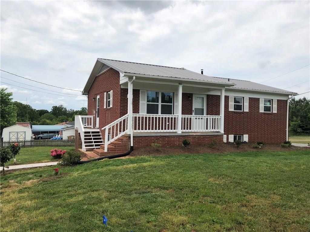 800 St James Church Road Newton, NC 28658 - Photo 23 of 27 a view of a house with a backyard