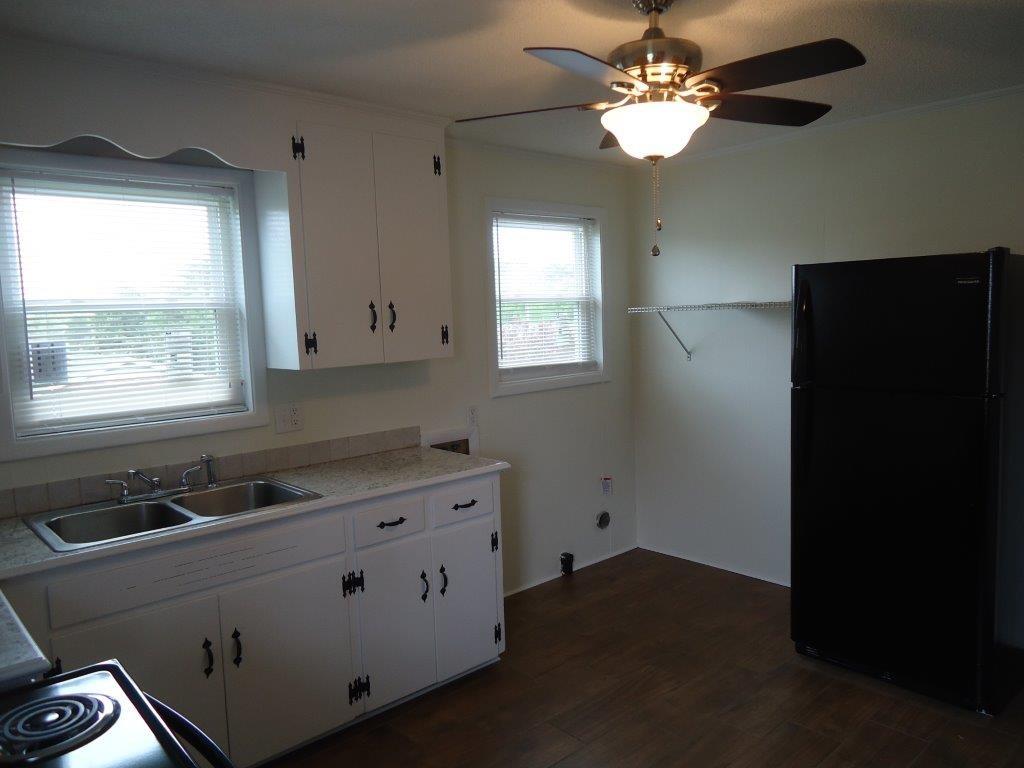 800 St James Church Road Newton, NC 28658 - Photo 9 of 27 a kitchen with a sink and a window