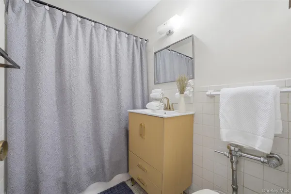 a bathroom with a sink and mirror