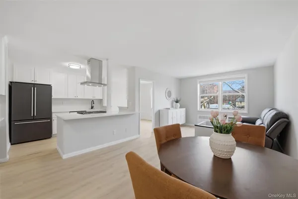 a living room with kitchen island furniture and a kitchen view