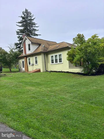 a view of a house with a big yard