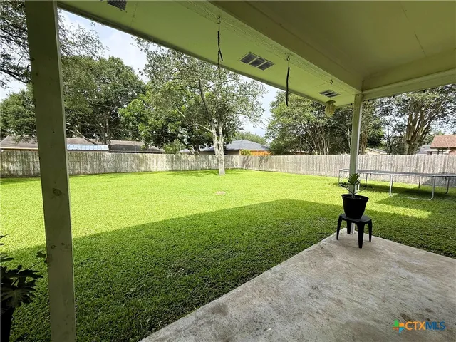 a view of a garden with a slide