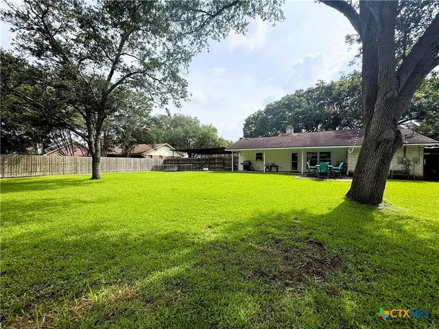 a view of a house with a big yard