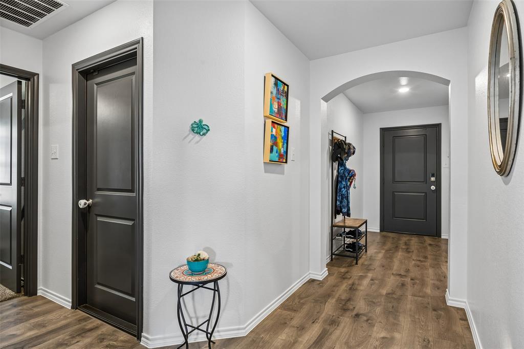 802 Rustic Way Royse City, TX 75189 - Photo 7 of 38 a view of a hallway with a livingroom and furniture