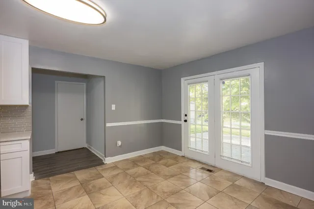 a view of an empty room and window