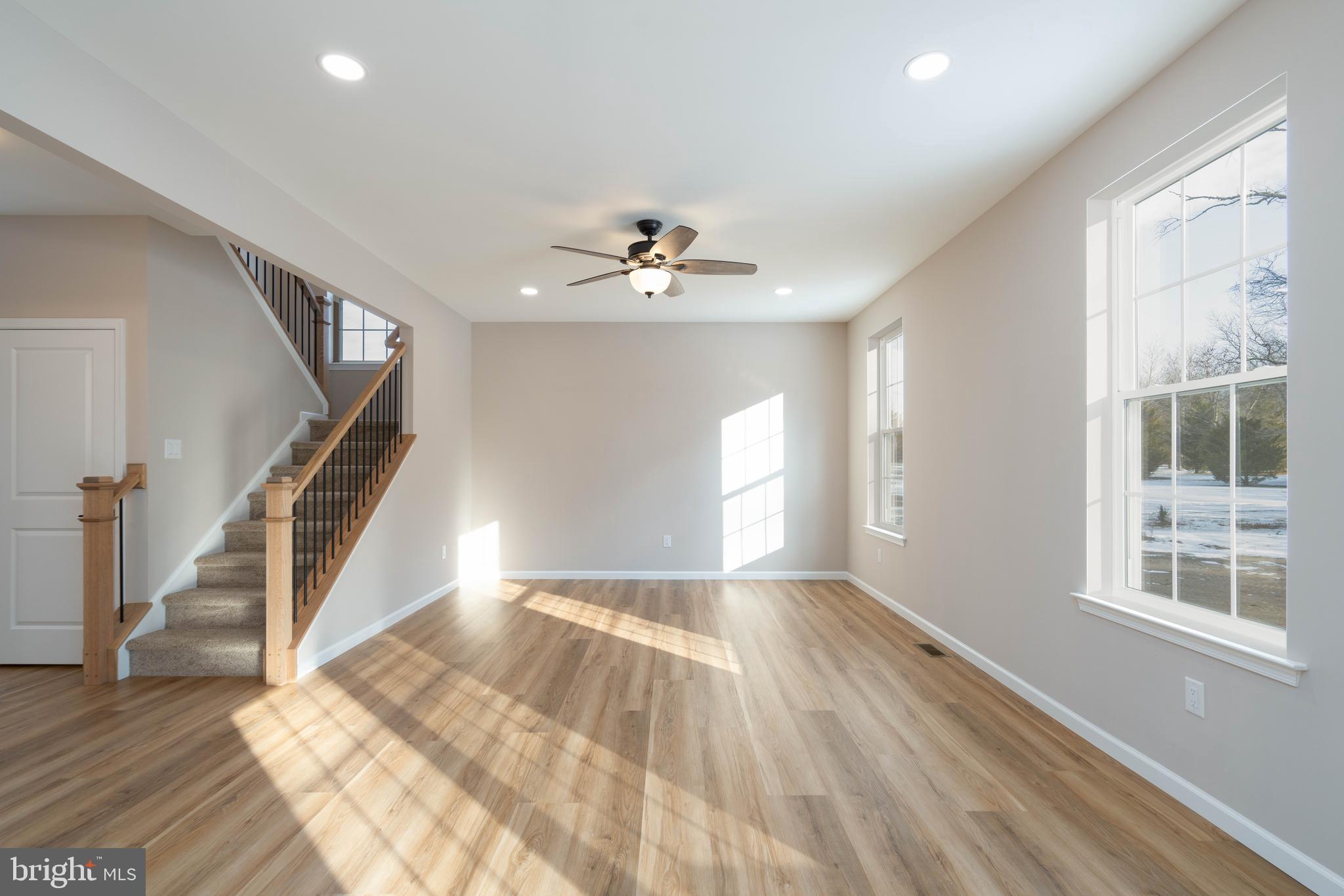 1162 South Spring Road Vineland, NJ 08361 - Photo 24 of 57 a view of an empty room with wooden floor and a window