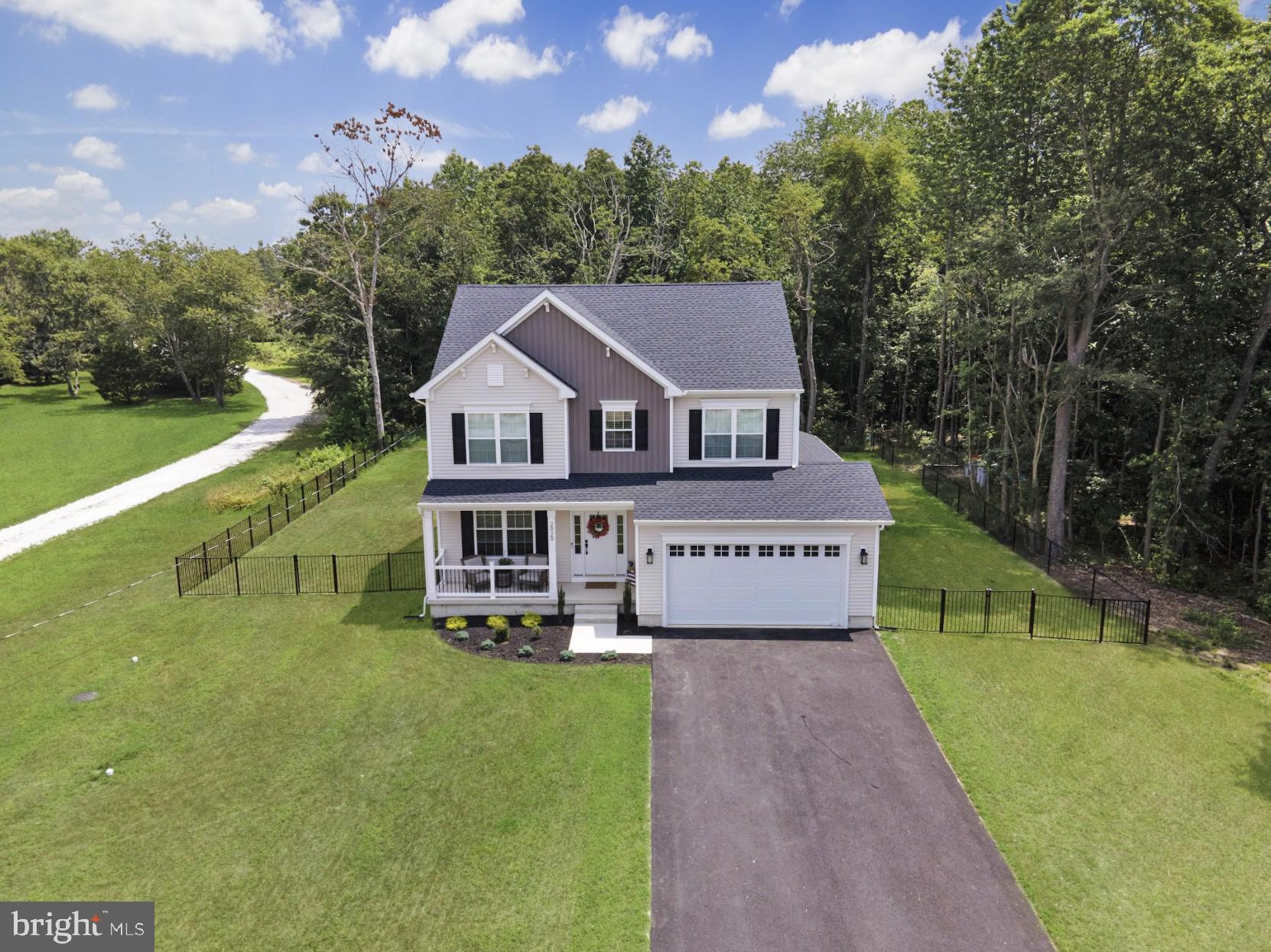 1162 South Spring Road Vineland, NJ 08361 - Photo 3 of 57 a view of a house with a big yard and large tree