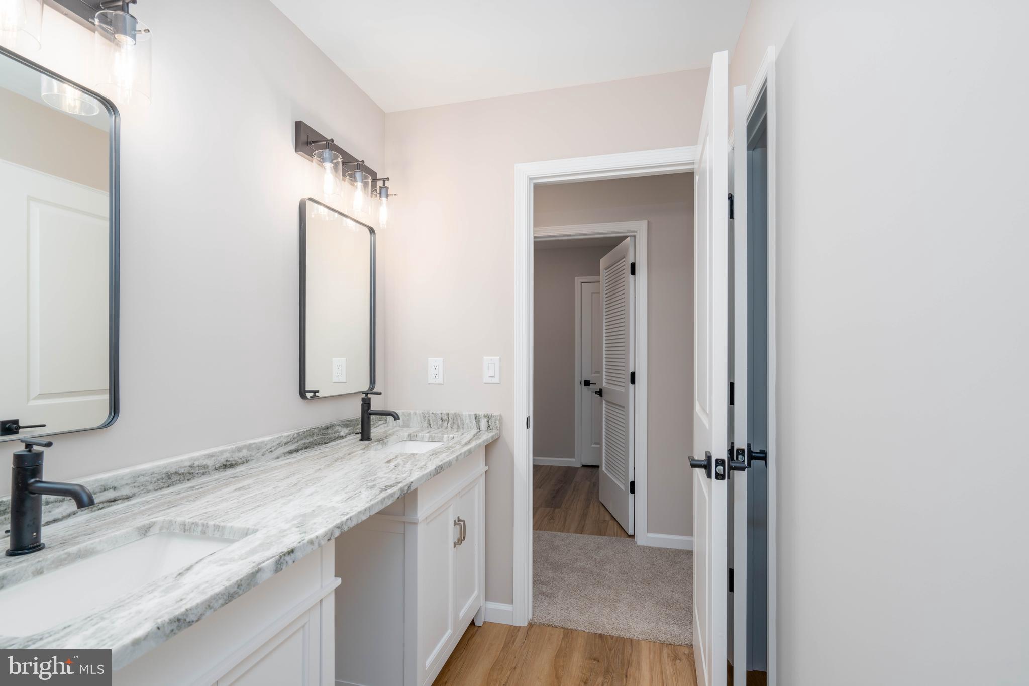 1162 South Spring Road Vineland, NJ 08361 - Photo 35 of 57 a bathroom with a granite countertop sink mirror and vanity