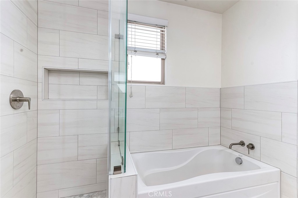596 South Brea Boulevard Brea, CA 92821 - Photo 28 of 33 a white bath tub and shower