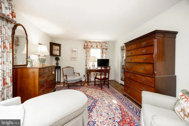 a bed room with furniture and a window