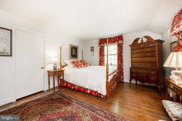 a view of house with a yard and furniture