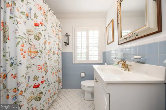 a view of house with a patio and a yard