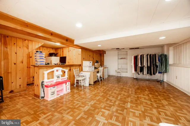 a view of a patio with chair and tables back yard of the house