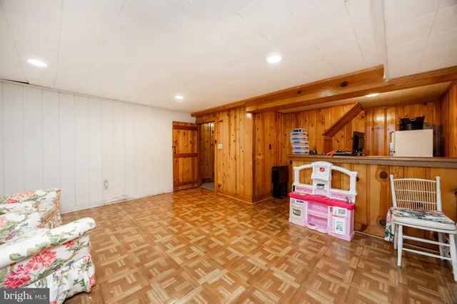a front view of a house with a yard table and chairs
