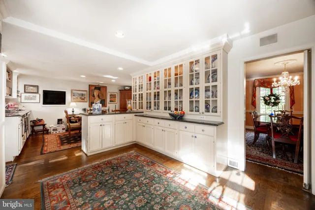 a kitchen with stainless steel appliances a stove a microwave and cabinets