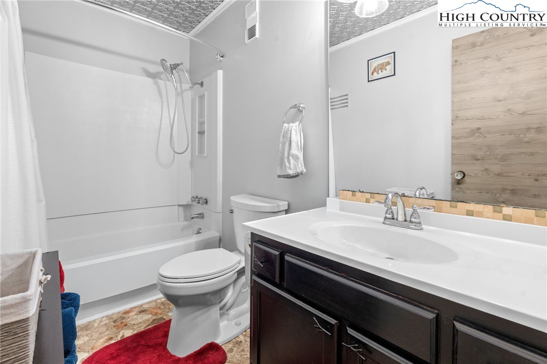 301 Pinnacle Inn Road, Unit 3219 Beech Mountain, NC 28604 - Photo 18 of 30 a bathroom with a sink toilet vanity and shower