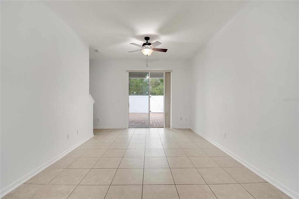 9161 Shepton Street Orlando, FL 32825 - Photo 19 of 62 wooden floor in an empty room with a window