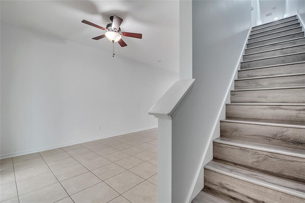 9161 Shepton Street Orlando, FL 32825 - Photo 22 of 62 a view of entryway and hall with wooden floor
