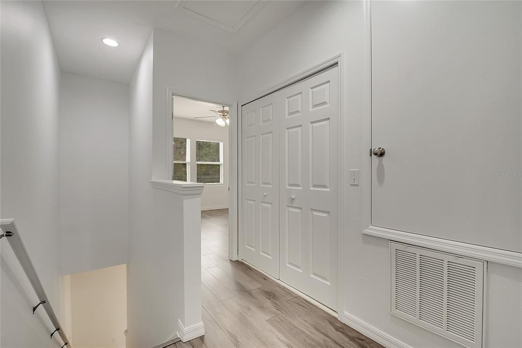 9161 Shepton Street Orlando, FL 32825 - Photo 24 of 62 a view of a hallway with wooden floor