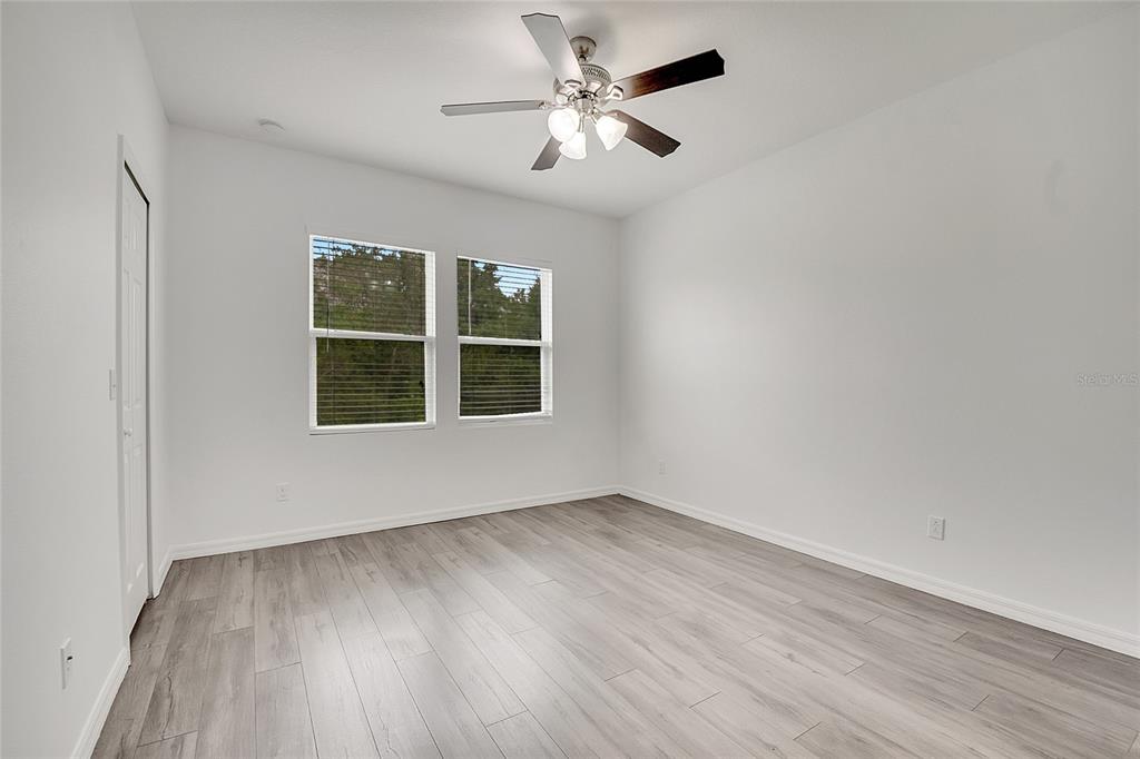 9161 Shepton Street Orlando, FL 32825 - Photo 25 of 62 wooden floor in an empty room with a window