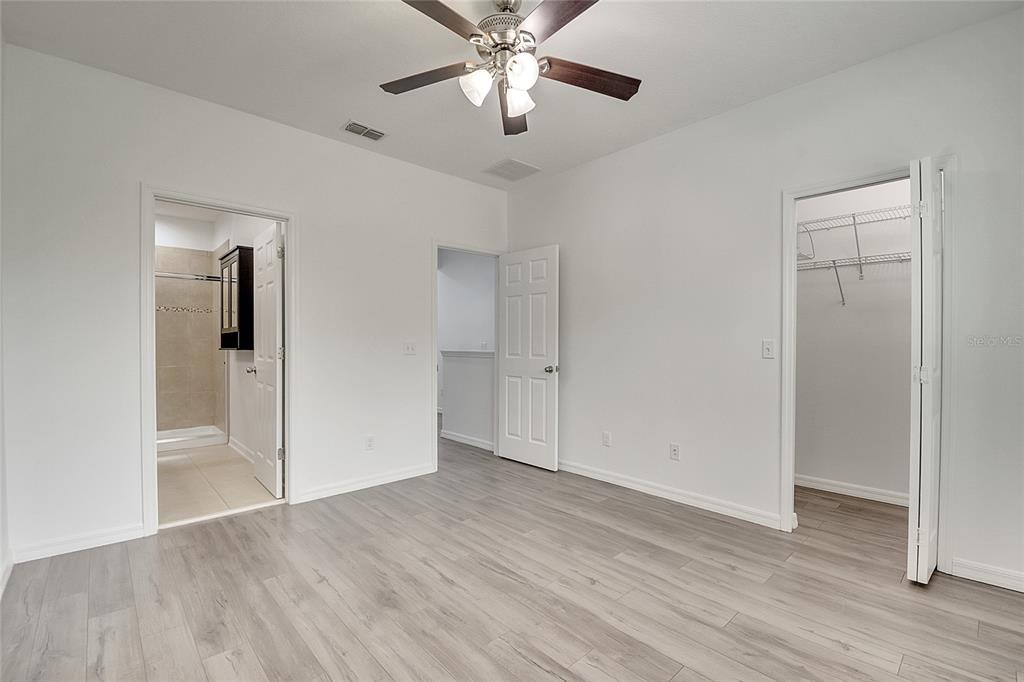 9161 Shepton Street Orlando, FL 32825 - Photo 26 of 62 wooden floor in an empty room with a window