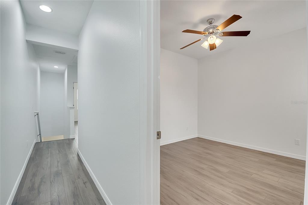 9161 Shepton Street Orlando, FL 32825 - Photo 33 of 62 wooden floor in an empty room with a window