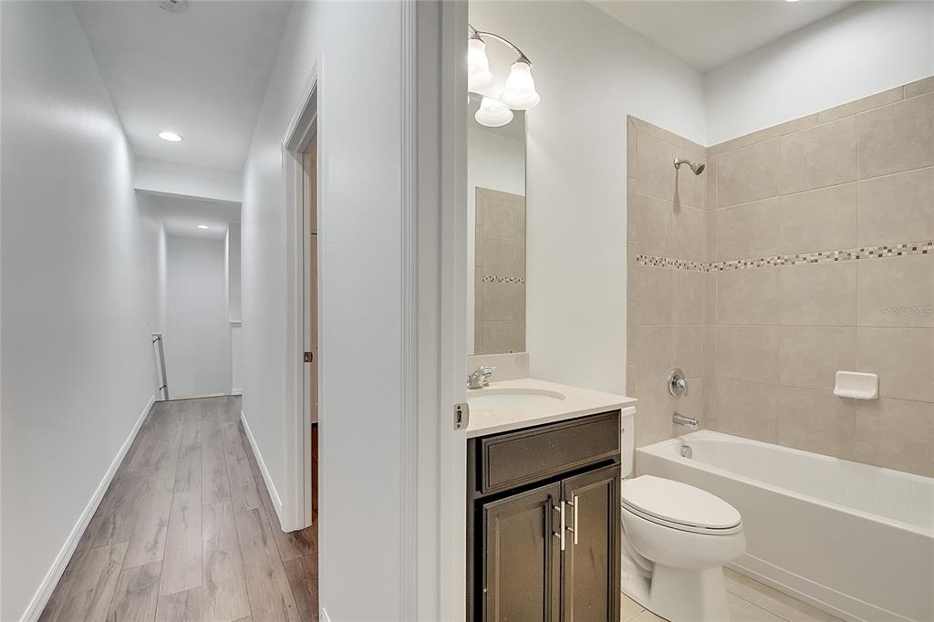 9161 Shepton Street Orlando, FL 32825 - Photo 36 of 62 a bathroom with a sink a toilet and shower