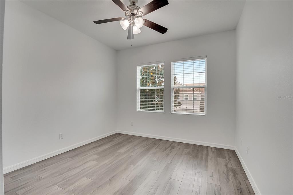 9161 Shepton Street Orlando, FL 32825 - Photo 39 of 62 wooden floor in an empty room with a window