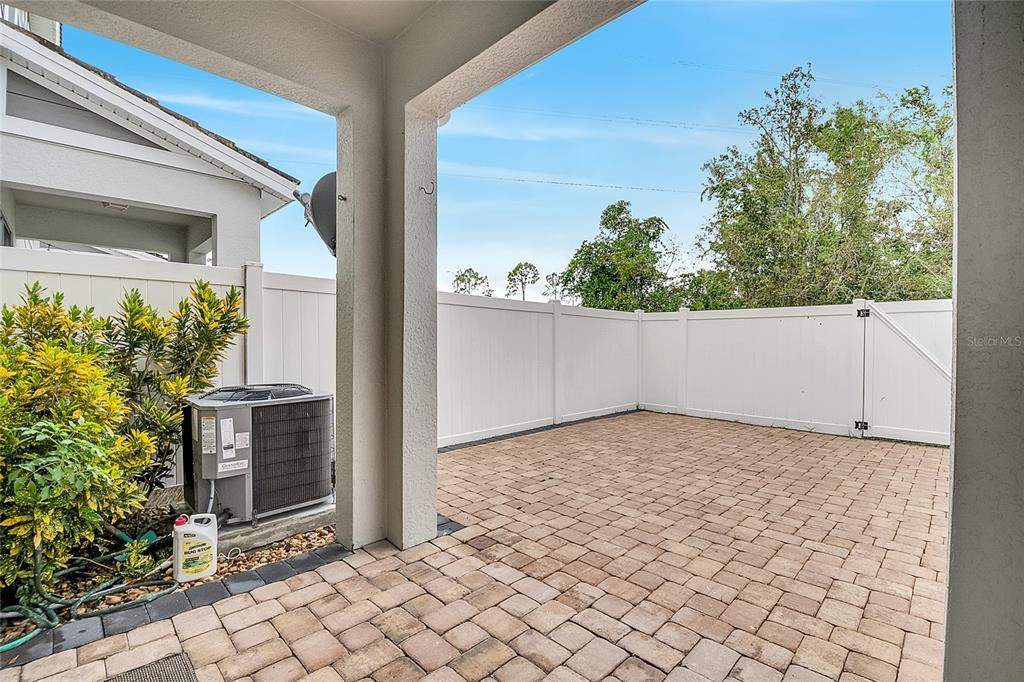 9161 Shepton Street Orlando, FL 32825 - Photo 43 of 62 a view of a backyard of the house