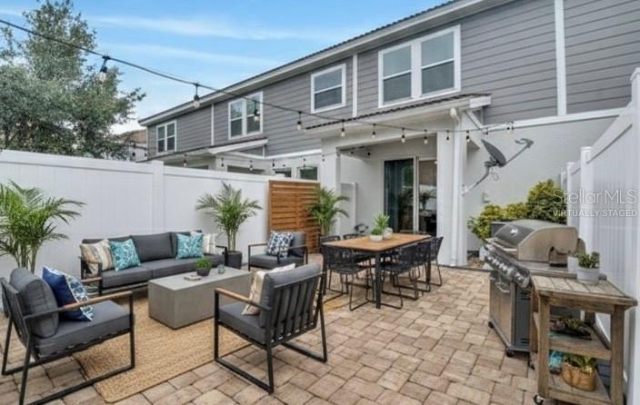 9161 Shepton Street Orlando, FL 32825 - Photo 45 of 62 a view of a patio with table and chairs and potted plants