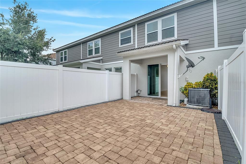 9161 Shepton Street Orlando, FL 32825 - Photo 46 of 62 a front view of a house with a yard