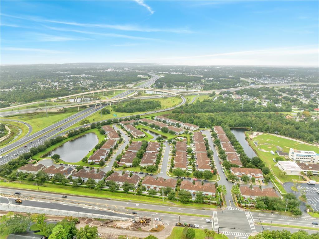 9161 Shepton Street Orlando, FL 32825 - Photo 50 of 62 an aerial view of residential building with outdoor space swimming pool and ocean view
