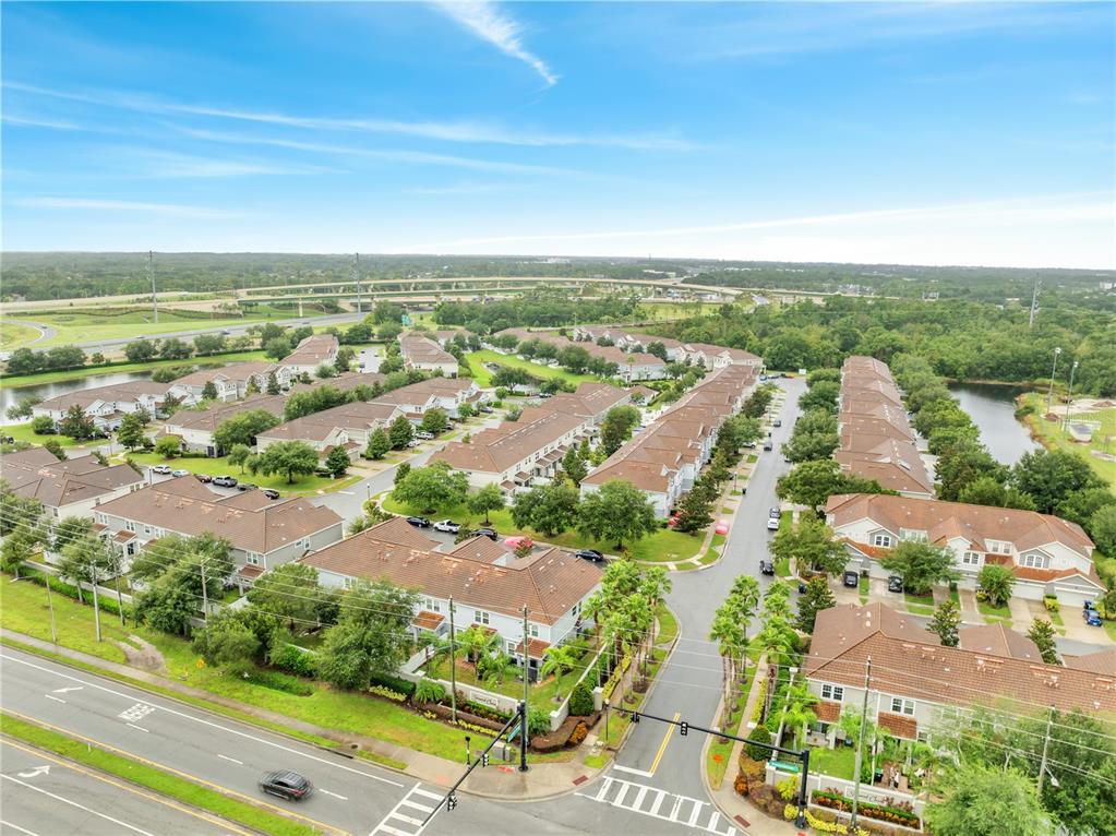 9161 Shepton Street Orlando, FL 32825 - Photo 52 of 62 an aerial view of residential building and lake view