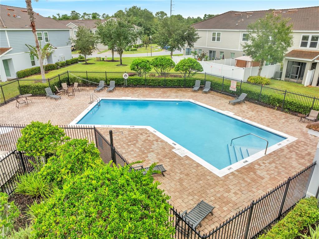 9161 Shepton Street Orlando, FL 32825 - Photo 57 of 62 an aerial view of a house with swimming pool patio and outdoor seating