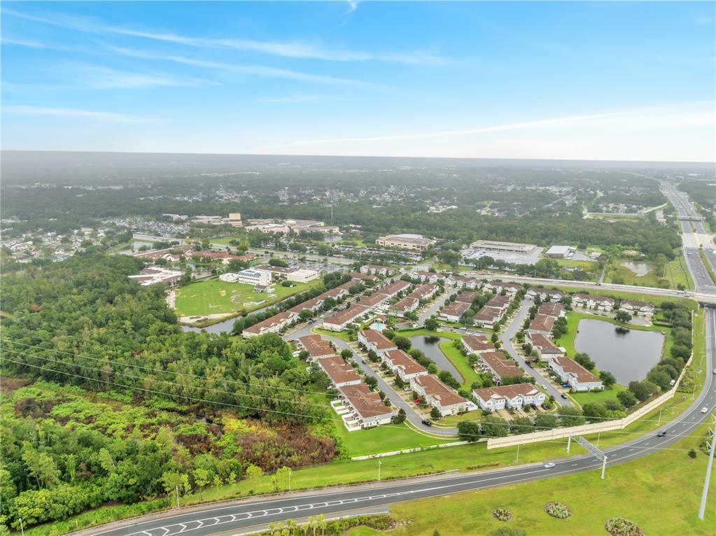 9161 Shepton Street Orlando, FL 32825 - Photo 59 of 62 an aerial view of residential houses with outdoor space
