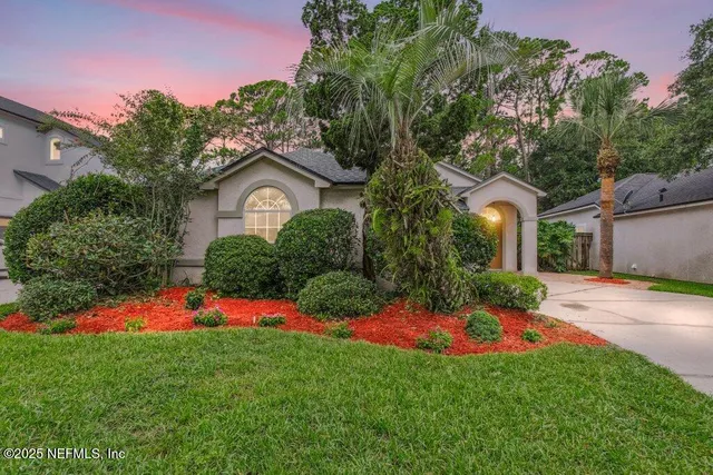 a living room with furniture a window and a table