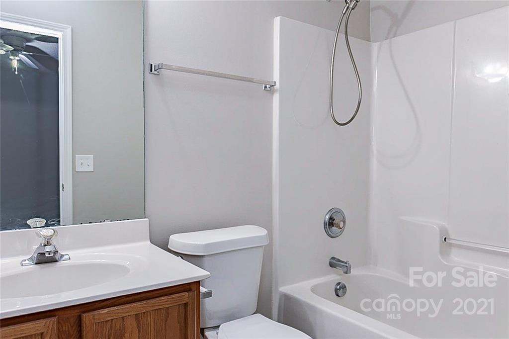 1216 Winding Path Road Clover, SC 29710 - Photo 11 of 15 a bathroom with a sink a toilet and shower