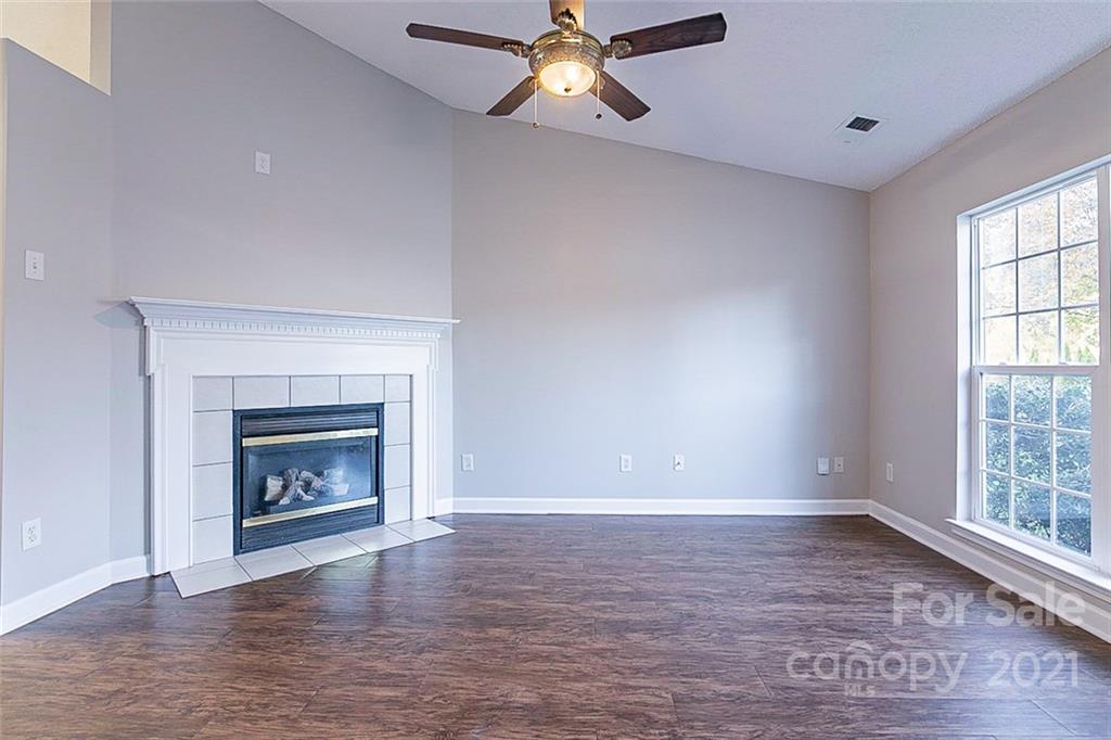1216 Winding Path Road Clover, SC 29710 - Photo 5 of 15 an empty room with windows and a fireplace